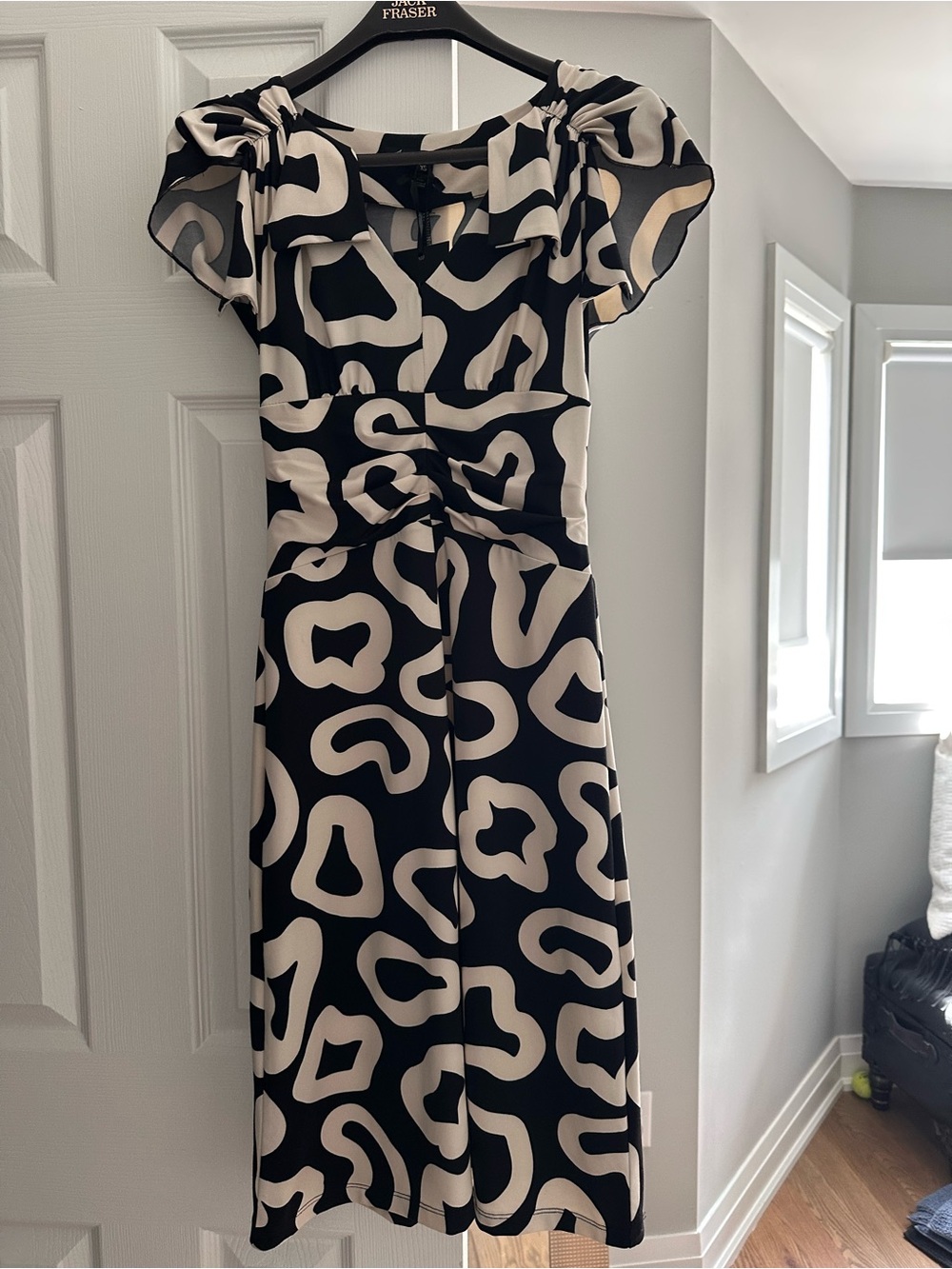 Elegant Black and Cream Midi Dress with Abstract Pattern